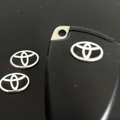 1x TOYOTA Schlüssel OVAL 15mm Aufkleber ALU Schlüssellogo Emblem Schriftzug LOGO